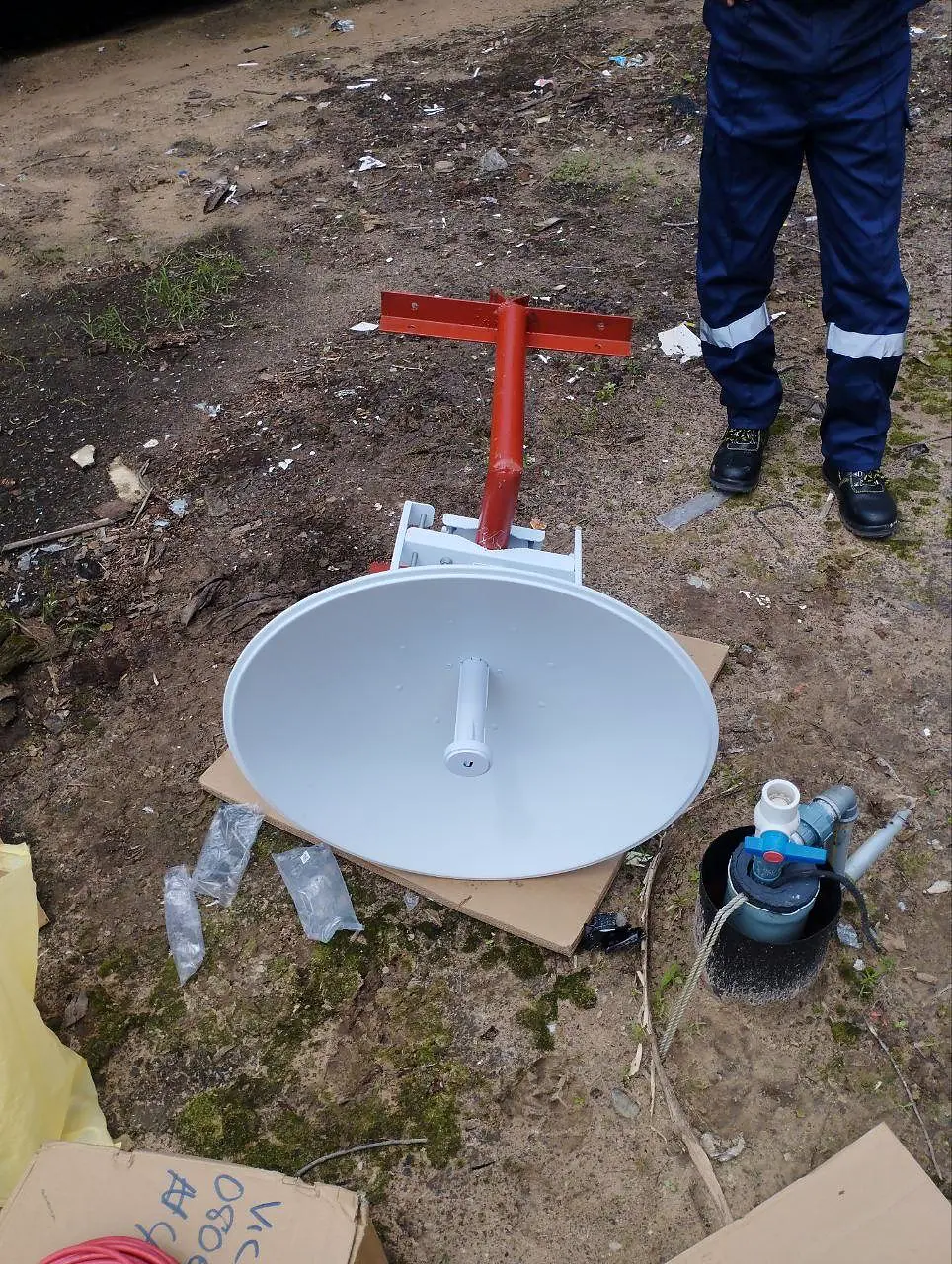 Dish antenna and mounting hardware prepared for flow-station installation